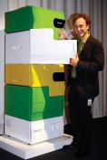 Electrolux Design Lab 2008 winner Stefan Buchberger displays the Flatshare refrigerator, which has separate drawers for each user. Individual users can personalize their drawer with a colorful "skin."