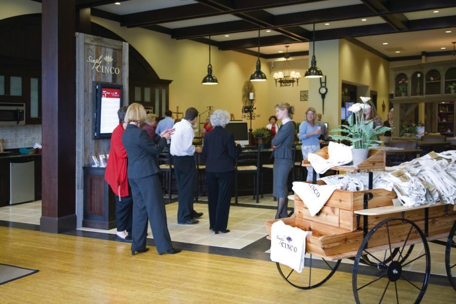 MEETING SPACE: Simply Cinco, the information center for Newland Communities’ Cinco Ranch in Katy, Texas, builds traffic by hosting local groups, such as this Chamber of Commerce event.