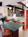Architect Anne Phillips preserved views of the ceiling structure and painted beams a dark eggplant to make Joseph Eichler's "trademark post-and-beam system pop."