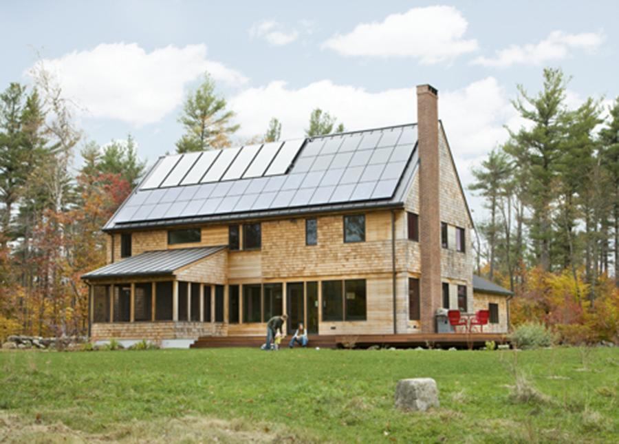 The zero-energy dwelling features south-facing solar panels discreetly tucked away on the back of the home.