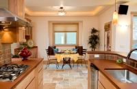 Knotty alder cabinetry in the kitchen is constructed with a zero-VOC composite particleboard interior and treated with a zero-VOC finish. Kitchen countertops are PaperStone, manufactured from 50 percent recycled newsprint.