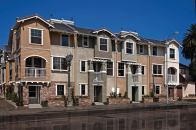 That's a Wrap: Hollywood's newest residential address clusters 34 detached brownstones around the neighborhood's oldest-standing house, a 1904 frame house being renovated into a museum.