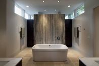 The centerpiece of this serene bath designed by Austin, Texas-based architect Jay Corder is a natural marble slab serving as a tub backsplash on one side and a shower wall on the other. www.jaycorder.com