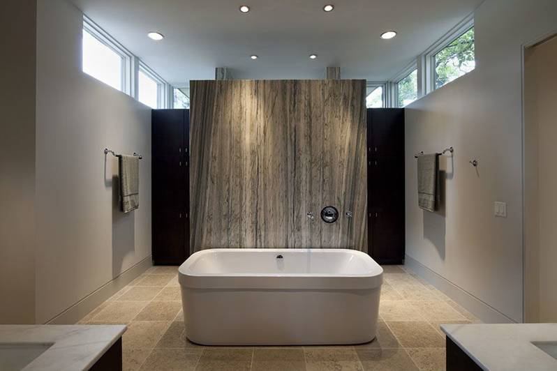 The centerpiece of this serene bath designed by Austin, Texas-based architect Jay Corder is a natural marble slab serving as a tub backsplash on one side and a shower wall on the other. www.jaycorder.com