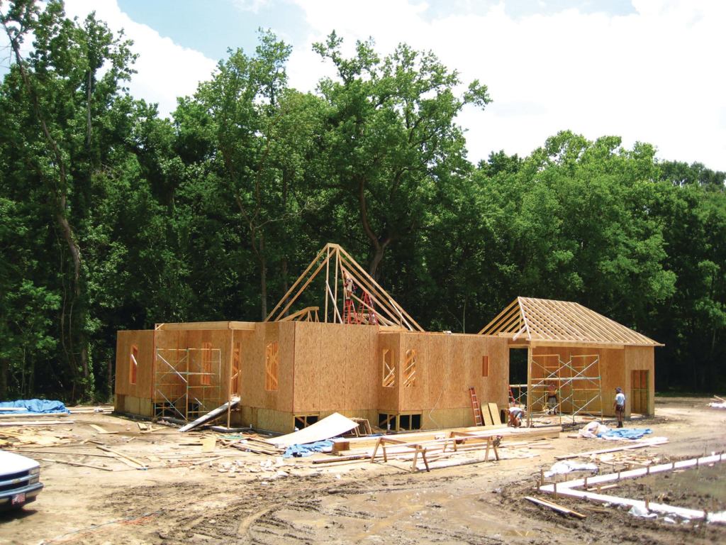 Going Up, Going Green: Builder Roy Domangue's trio of homes will be left partially finished to showcase various green building methods and materials to educate his peers, consumers, lenders, and regulatory agencies.