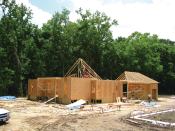 Going Up, Going Green: Builder Roy Domangue's trio of homes will be left partially finished to showcase various green building methods and materials to educate his peers, consumers, lenders, and regulatory agencies.