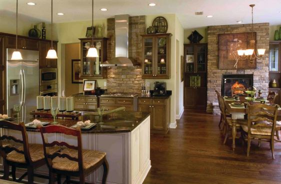 GEOMETRY LESSON: The Genesis Collection concentrates dollars and square footage where people spend most of their time. The social spaces in each plan form a "lifestyle triangle"--an interactive spatial dynamic among kitchen, cafe eating area, and informal living space.