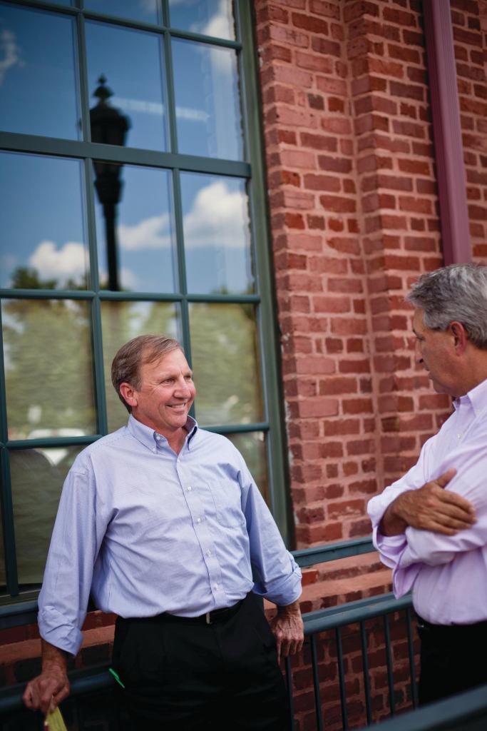 Alan Simonini talks with his business partner Ray Killian near their offices in Charlotte, NC.