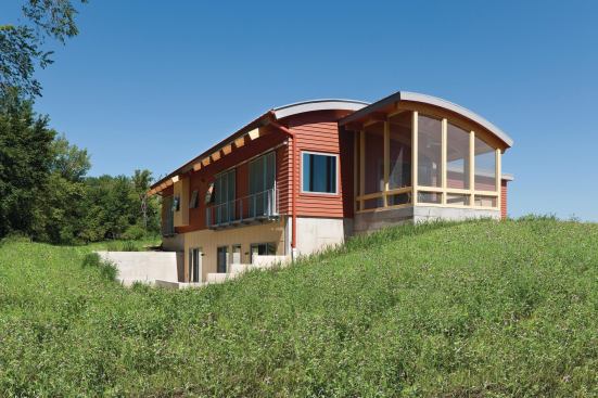 This home has south-facing glass doors with sliding metal sunscreens that reduce glare and heat gain.