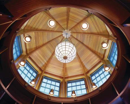 Shope Reno Wharton placed this sunlit library tower at the one end of the building to capture waterfront views and to balance out the home's massing.