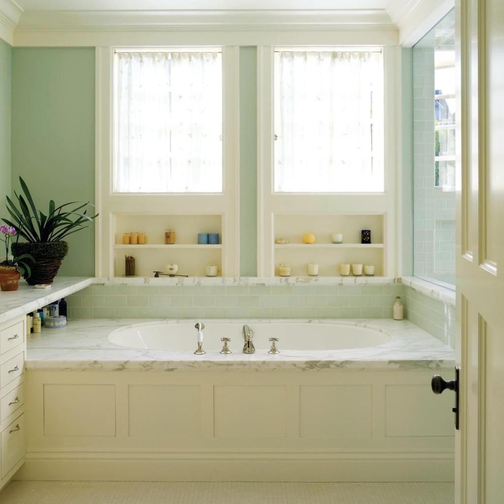 For privacy, architect Aleck Wilson placed the sills of the windows above waist height. He located the window heads at the ceiling trim and filled the spaces below them with shelf niches.