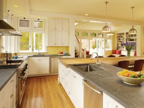With its L-shaped floor plan, this multifunction kitchen offers a set of subtly overlapping zones.