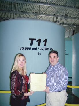 A Green Alternative Poly-Green's COO Jeff Schultheis (right) and director of business development Stephanie Malas hold a sample of hard insulation made from the biopolyol their company's plant produces.