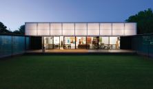 This translucent, operable awning also serves as a building-width light fixture.