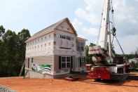 Landmark Setting Cranes place the modules on a jobsite in Axton, Va., for the 35,000th house that modular manufacturer Nationwide Homes has produced in its 52 years.
