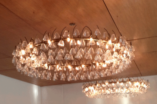 Architect Vilhelm Lauritzen designed the dining room's delicate chandeliers.
