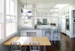 A long, open southern exposure and a generous bank of skylights puts this kitchen in the spotlight. Located between living/dining and breakfast/family rooms, it mediates between the house's formal and casual spaces.