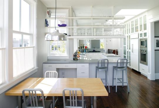 A long, open southern exposure and a generous bank of skylights puts this kitchen in the spotlight. Located between living/dining and breakfast/family rooms, it mediates between the house's formal and casual spaces.