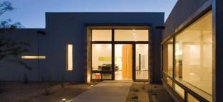 Ibarra Rosano wields glazing to control views, as well as heat gain. Slot windows frame courtyard vignettes, while a large, north-facing opening along the bedroom gallery maximizes daylight without direct exposure to punishing rays.