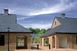 By facing the dormitory buildings onto a central lawn, Muse Architects bestowed a small town feeling on the project. Residents enjoy various levels of public space, including generously sized loggias and a communal lounge.