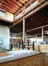 The Overland Partners offices capitalize on the open plan of a former plumbing warehouse to cultivate a collaborative work environment.