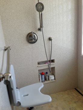 Shower Convenience: Lowered Niche The master shower features a wall niche about a foot above the floor where it's convenient for Rosemarie to store toiletries. The lowered niche makes for easier access than niches or shelves that are usually placed mid-way up the wall.