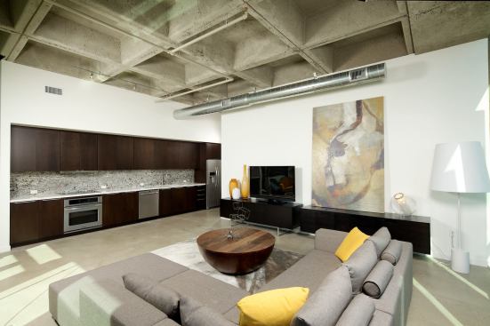 Kitchens occupy a single wall, minimizing their intrusion into the apartments' floor space.