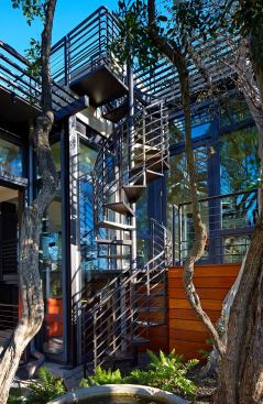 Roof space is used, too. A spiral staircase leads up to the deck.