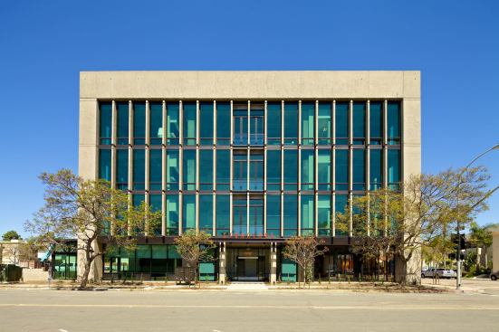 The building's concrete structure and glass facades made it an appealing candidate for conversion to loft apartments.