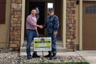 Saint Aubyn sales agent Kit Bradshaw with home buyer Lt. Commander Jose Vargas.