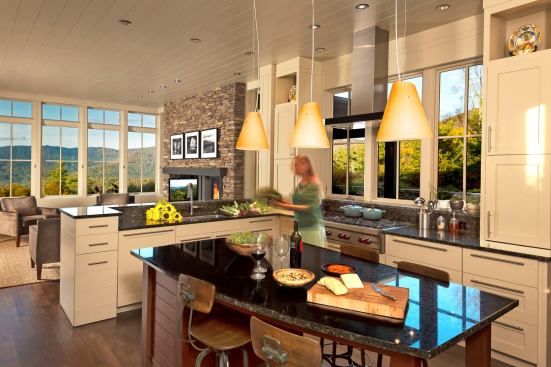 The open ktichen also looks out across the patio to the mountaintops beyond.