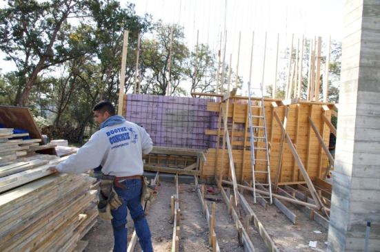 We had a 2? sandwich of Owens Corning XPS foam in the exterior concrete walls to separate the inside from out.