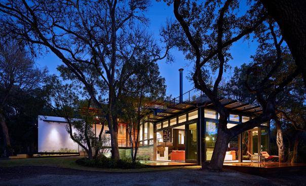 With the lights on at night, the house looks like a lantern in the landscape.