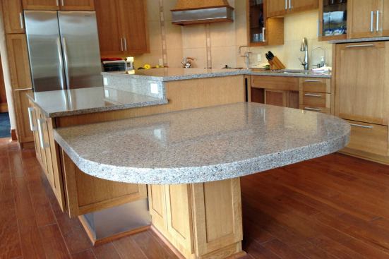 Island Hopping: Multi-level Kitchen Island Bakers have lauded the benefits of a lowered section of counter space, which offers better leverage for kneading and mixing. But multi-level countertops are ideal for universal design. In the UDLL kitchen island, a raised portion works well for Mark who stands well over 6 feet tall, and also makes room for easy-access undercounter appliances. Another section of the island stands at traditional 36-inch height, while a lowered section is ideal for seated cooks, homework, or casual dining.