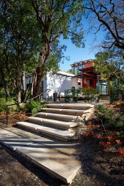 To hew to the size of neighboring homes, this house was kept mostly to one story.