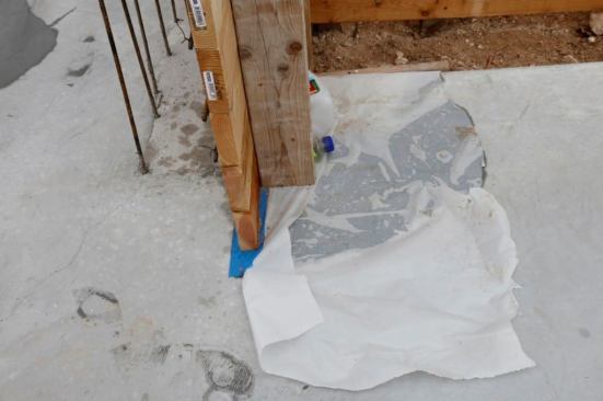 Notice the blue tape at the bottom of the wall formwork.