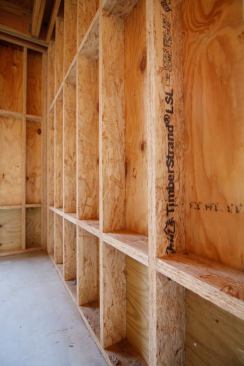 Notice we sheathed the house with CDX plywood. I like having the real plywood so that we have some hygric bu