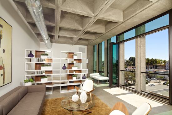 Coffered concrete ceilings establish a strong visual rhythm overhead.