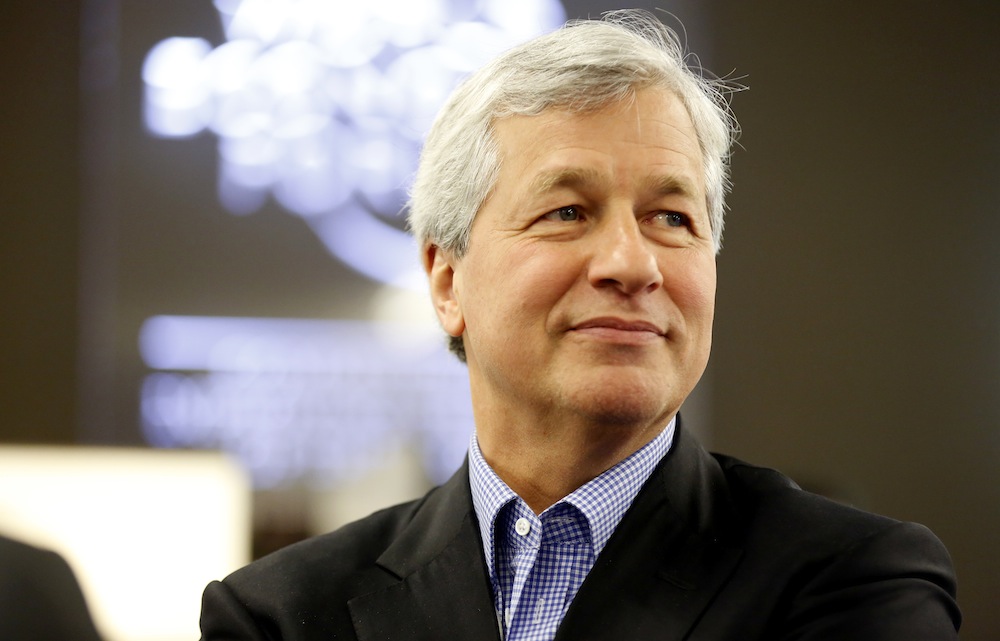 FILE PHOTO: James "Jamie" Dimon, chief executive officer of JPMorgan Chase & Co., pauses during a break in sessions on the opening day of the World Economic Forum (WEF) in Davos, Switzerland, on Wednesday, Jan. 22, 2014. Dimon, whose eight years atop JPMorgan Chase & Co. have made him one of Wall Streets most powerful leaders, said hell start treatment for throat cancer, raising new questions about succession plans at the biggest U.S bank. Photographer: Jason Alden/Bloomberg via Getty Images
