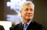 FILE PHOTO: James "Jamie" Dimon, chief executive officer of JPMorgan Chase & Co., pauses during a break in sessions on the opening day of the World Economic Forum (WEF) in Davos, Switzerland, on Wednesday, Jan. 22, 2014. Dimon, whose eight years atop JPMorgan Chase & Co. have made him one of Wall Streets most powerful leaders, said hell start treatment for throat cancer, raising new questions about succession plans at the biggest U.S bank. Photographer: Jason Alden/Bloomberg via Getty Images