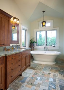 The pedestal tub and cabinetry channel the spirit of traditional Craftsman design, but both are brand new