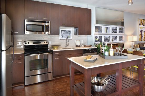 Kitchens feature movable islands and stainless steel appliances. Monthly rents at 77H range from $1,777 for a studio apartment to $5,096 for a two-bedroom plus den unit.