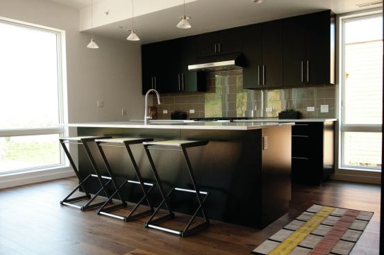 The kitchen has direct access to the outdoor deck.