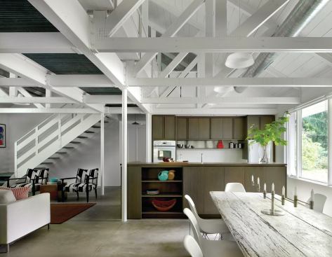 Rather than adding layers of finish materials, the basic core materials of the house’s construction define its character.