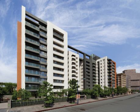 The buildings are tied together through the landscape design and a similar material palette including terracotta ceramic tile, self-cleaning white tile veneer, metal panels, and granite.