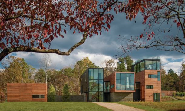The house’s entry elevation faces a clearing with views of the Blue Ridge Mountains.