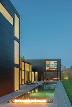 A gas flame lends a touch of drama to evenings on the pool deck.