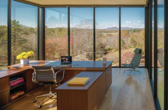 A top-floor office captures expansive views of the rolling property. 