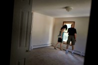 ANSONIA, CT - AUGUST 29: People look at a foreclosed home on August 29, 2010 in Ansonia, Connecticut. The home was one of numerous foreclosed homes on a bus tour organized by realtor Frank Hoinsky.Hoinsky has given over three of the tours which last for approximately three hours and stop at foreclosed homes in the lower Naugatuck Valley in Connecticut. As the American economy continues to struggle, housing prices are at an all-time low. Currently an estimated 1.65 million homes are in the foreclosure process in America.  (Photo by Spencer Platt/Getty Images)