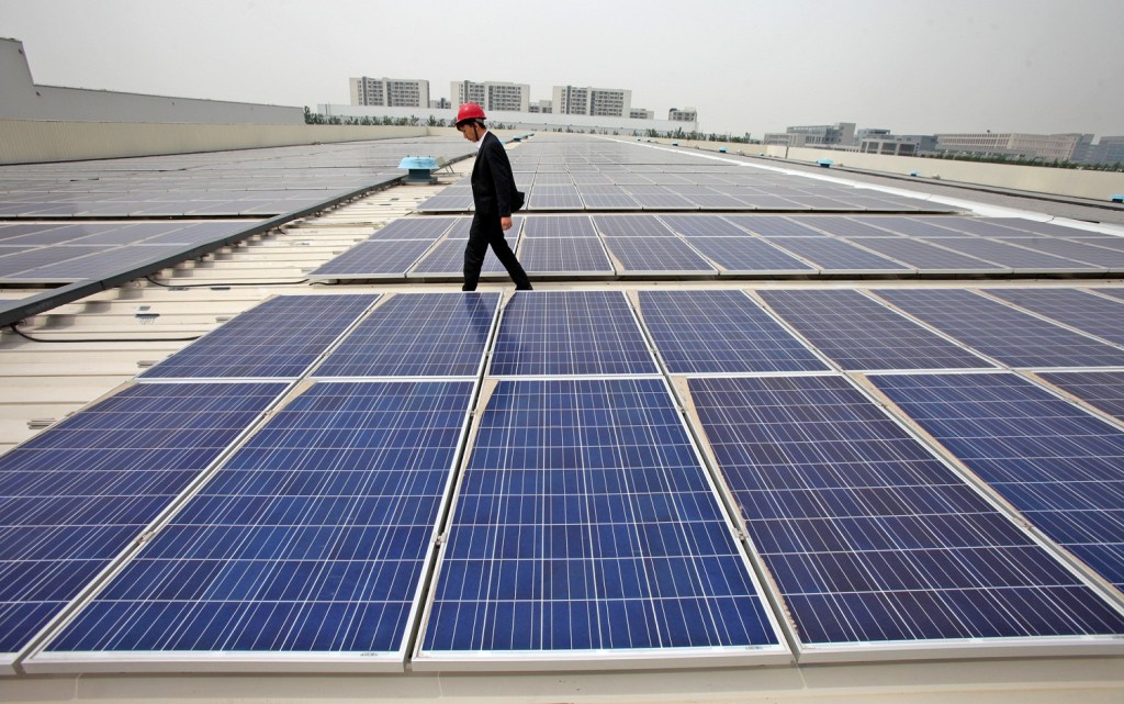 --FILE--A Chinese inspector examines solar panels at a rooftop photovoltaic power station in Tianjin, China, 13 May 2014.

The Commerce Department on Tuesday (3 June 2014) imposed steep duties on importers of Chinese solar panels made from certain components, asserting that the manufacturers had benefited from unfair subsidies. The duties will range from 18.56 to 35.21 percent, the department said. The decision, in a long-simmering trade dispute, addresses one of the main charges in a petition brought by the manufacturer SolarWorld Industries America. While it is preliminary, the ruling means that the United States will begin collecting the tariffs in advance of the final decision, expected later this year.